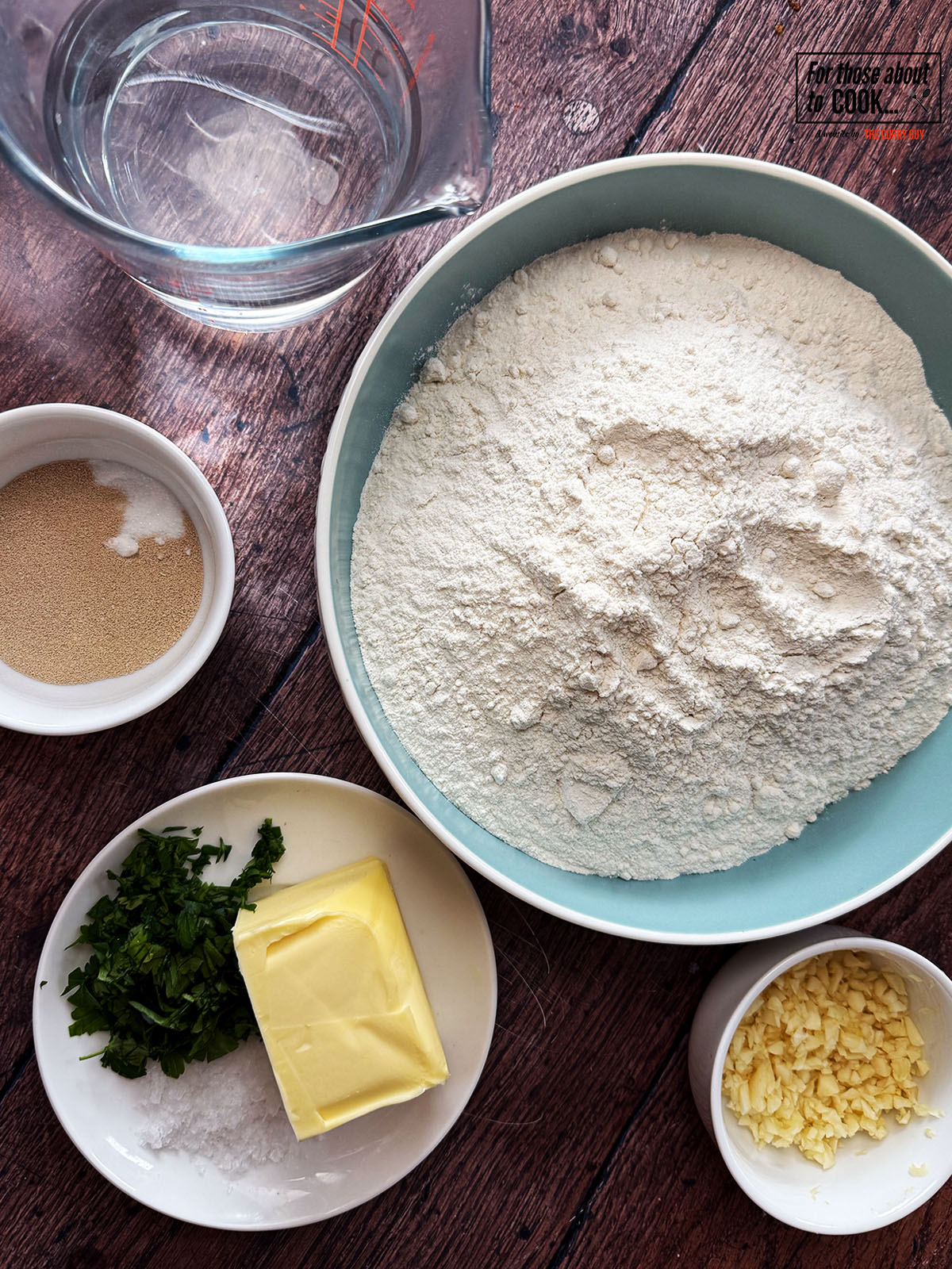 Ingredients for garlic dough balls separated into bowls