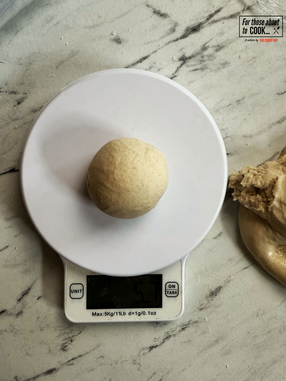 Dough split into 50g pieces and shaped into a dough ball 