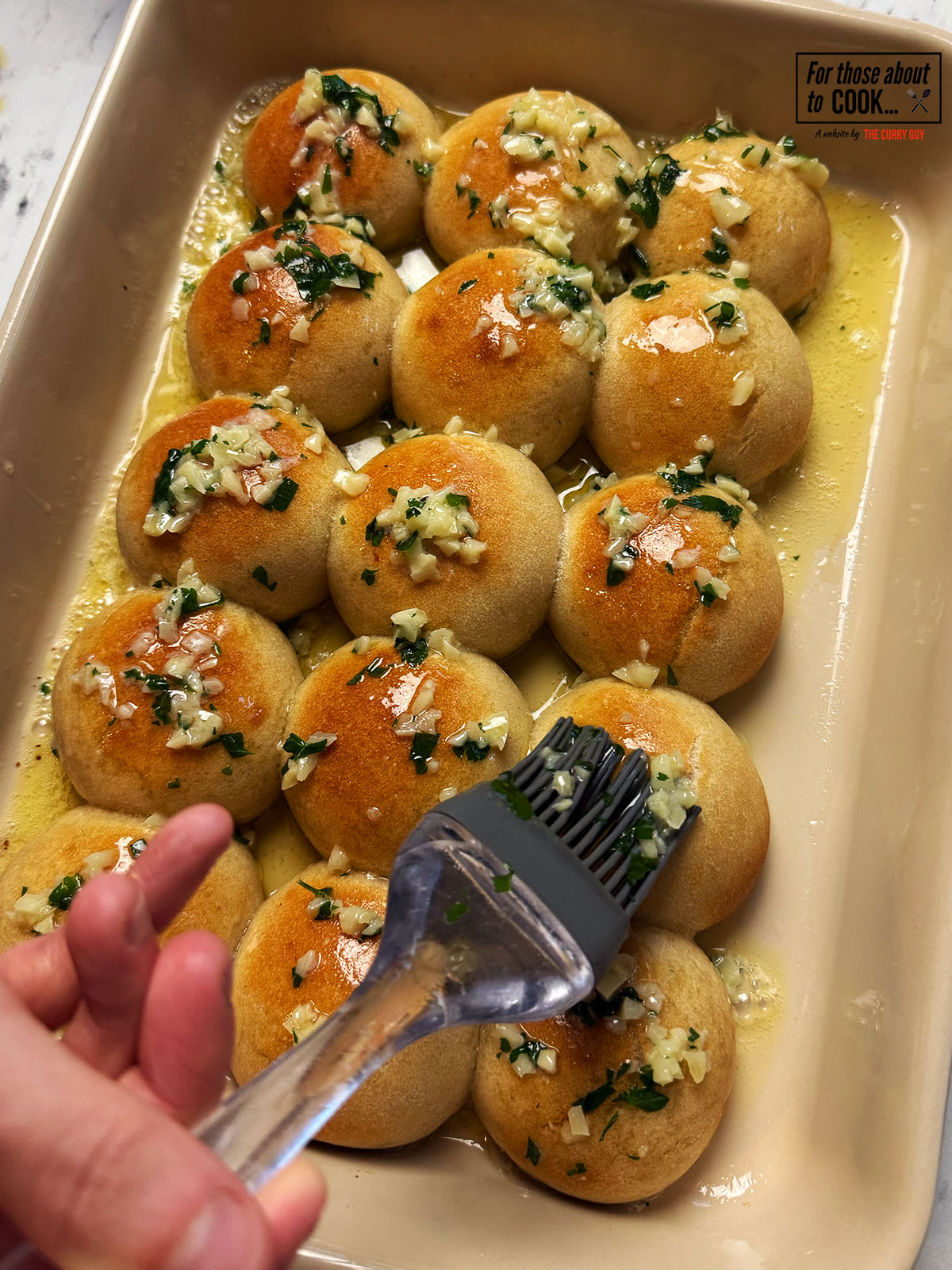 Dough balls brushed with garlic butter and parsley 