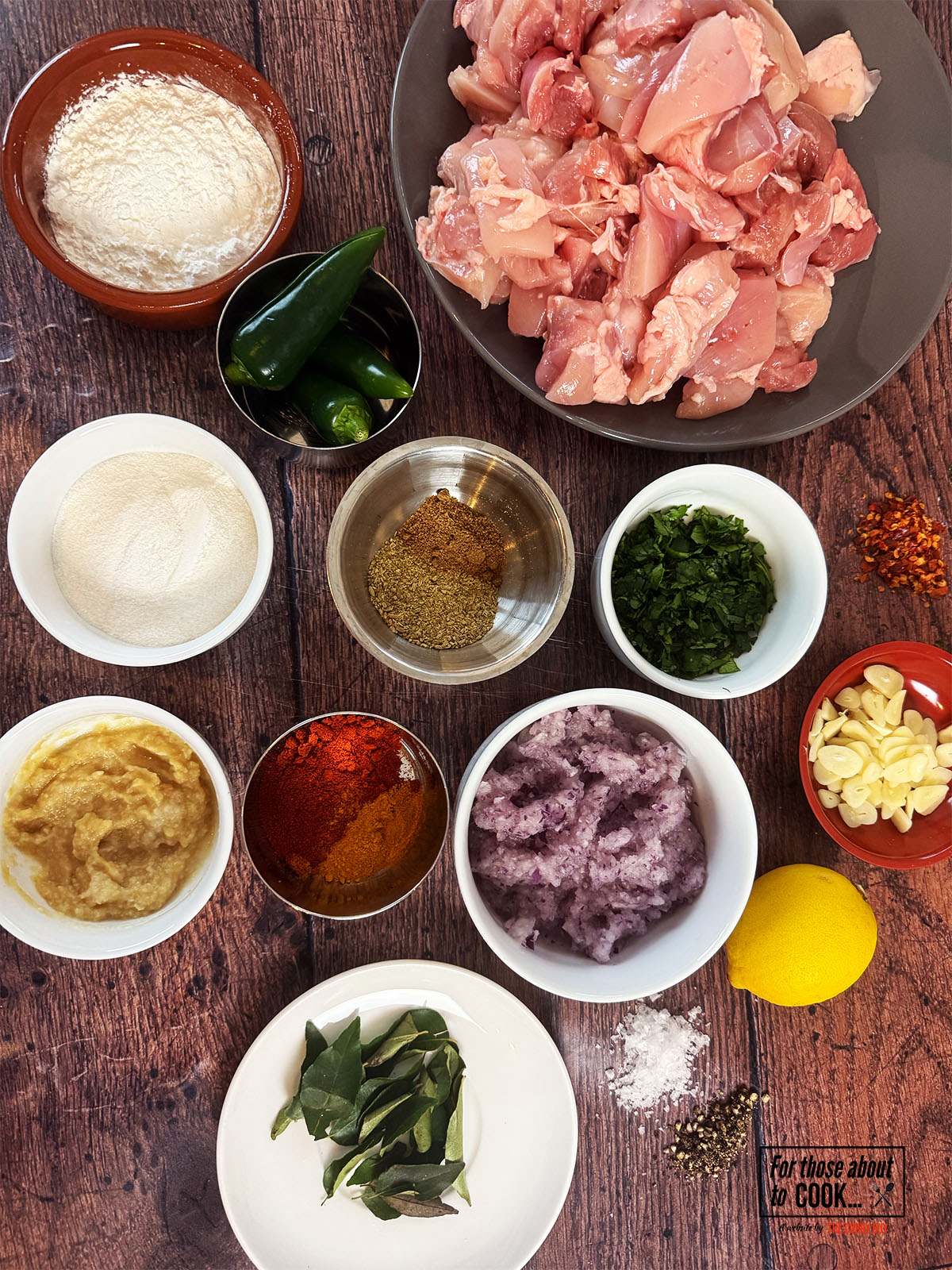 Ingredients for Karumura chicken separated into bowls