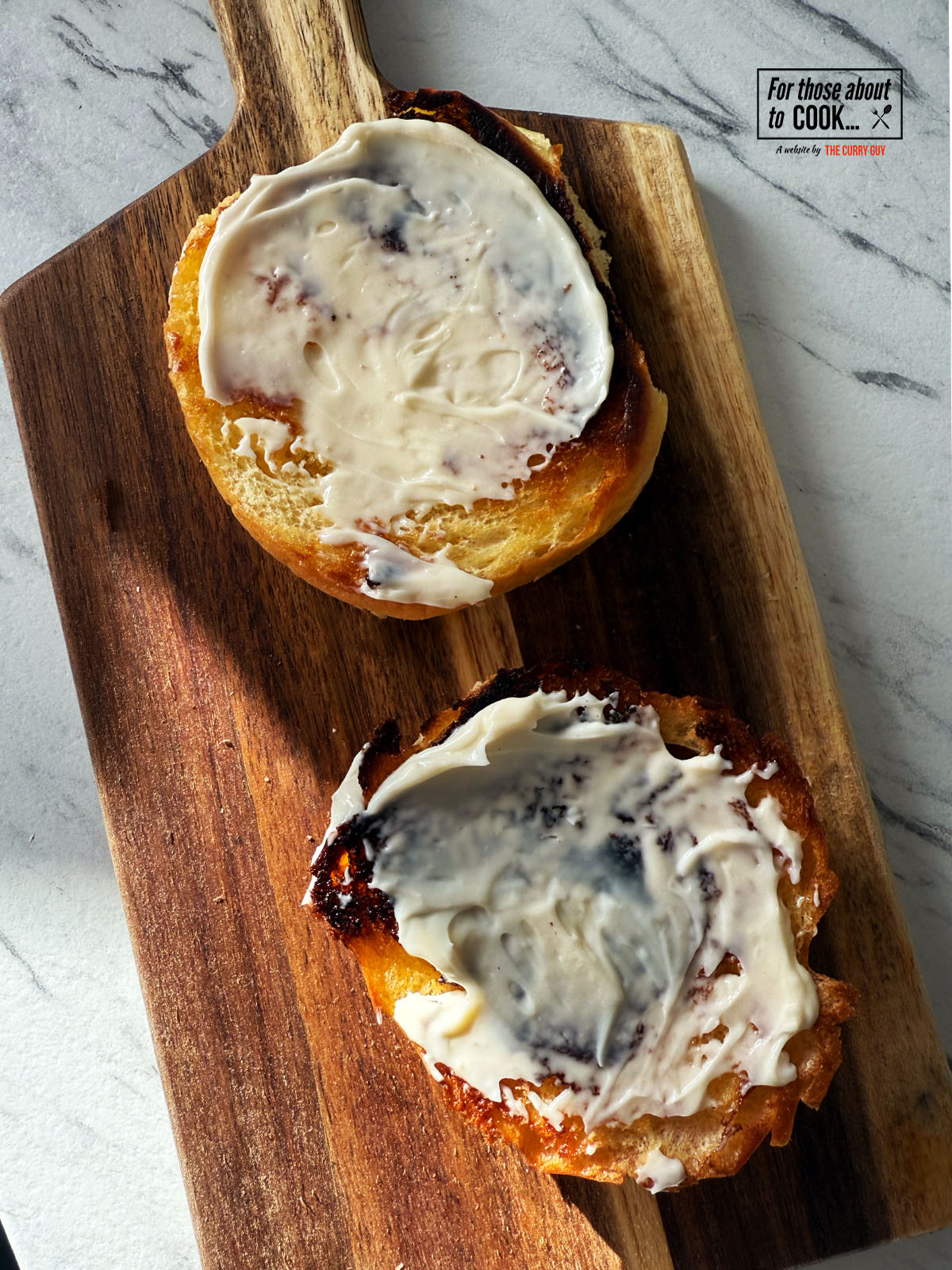 Toasted brioche buns slathered in mayonnaise 