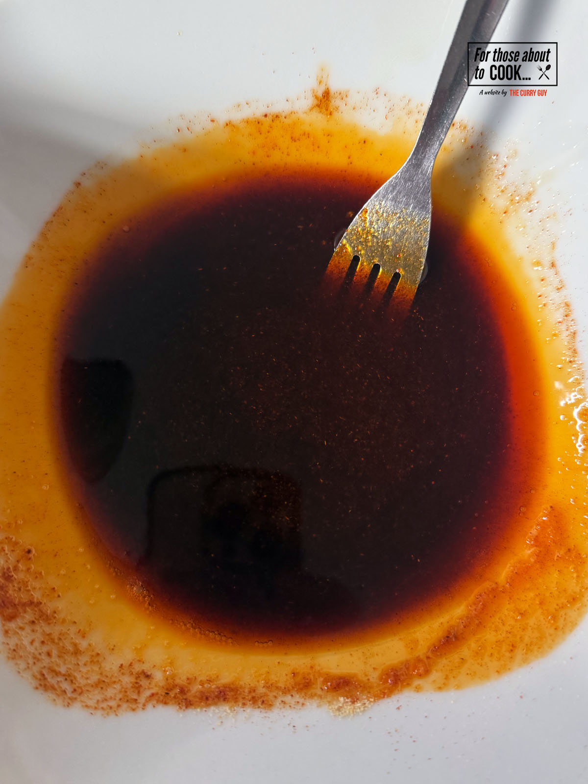 Oil and spices mixed in a bowl 