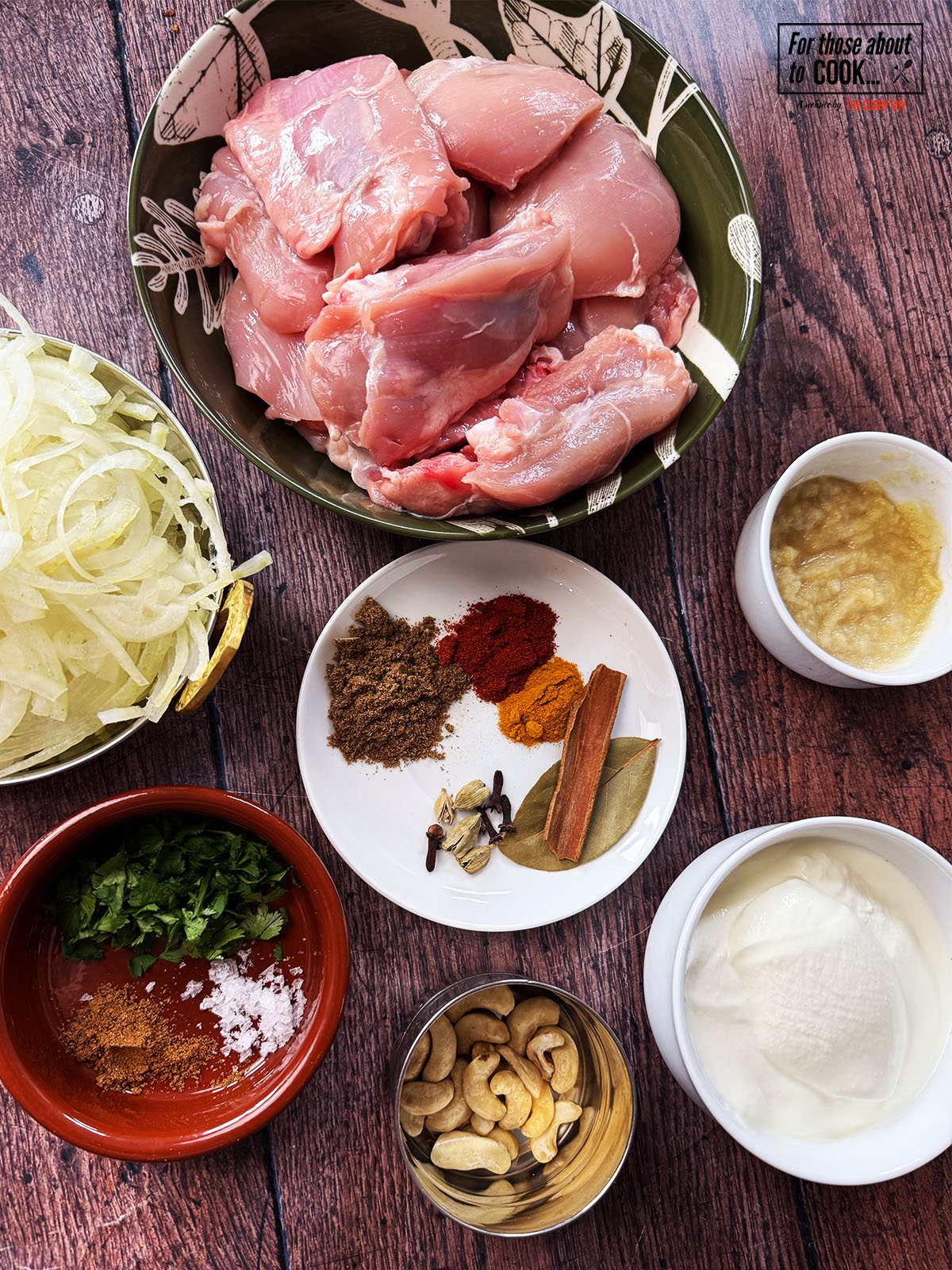 Ingredients for Nizami chicken curry separated into bowls
