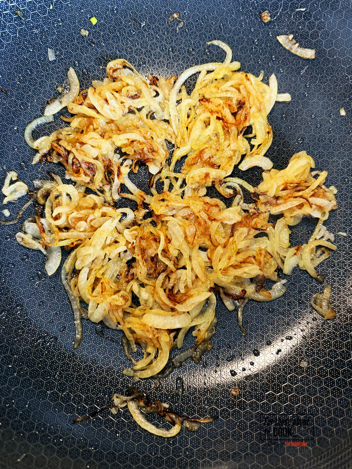 Onions fried until golden in spiced oil