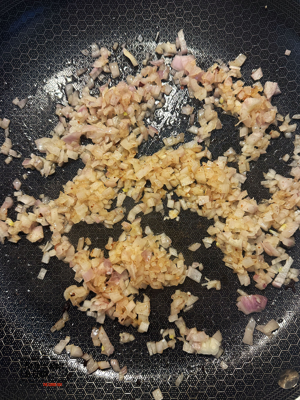 Shallots caramelizing in a pan