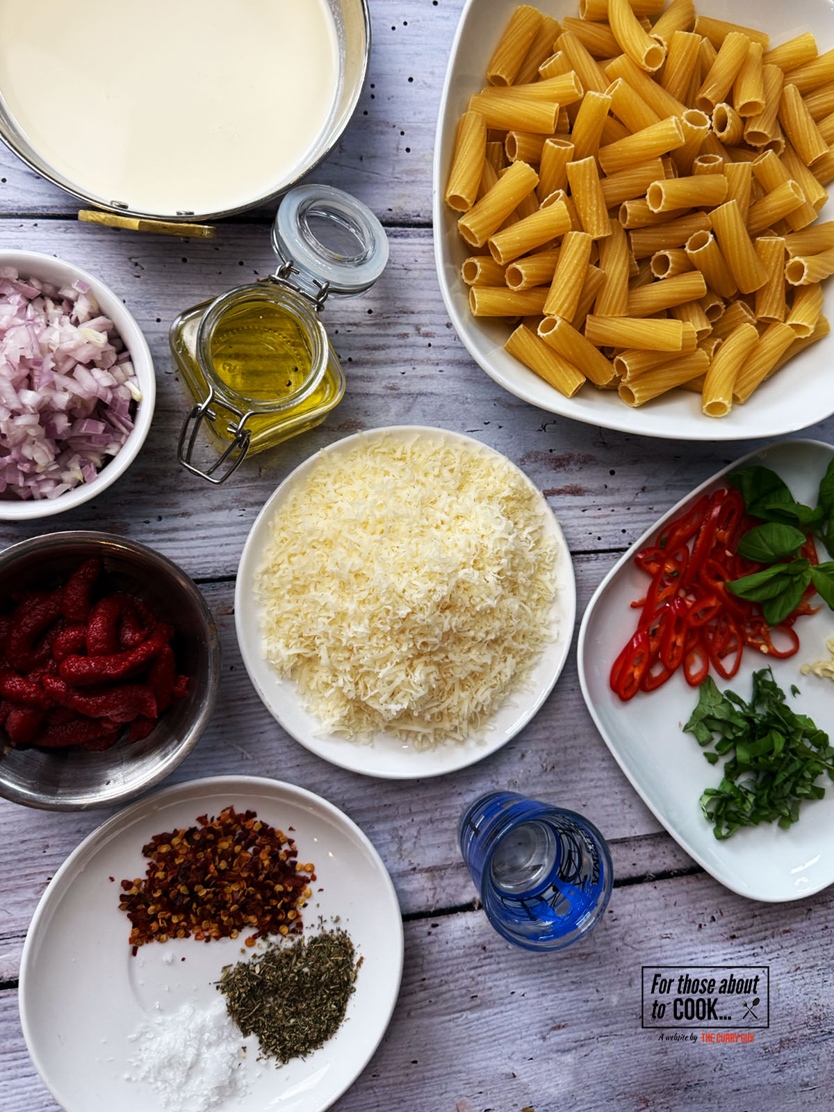 Ingredients for spicy vodka pasta separated into bowls