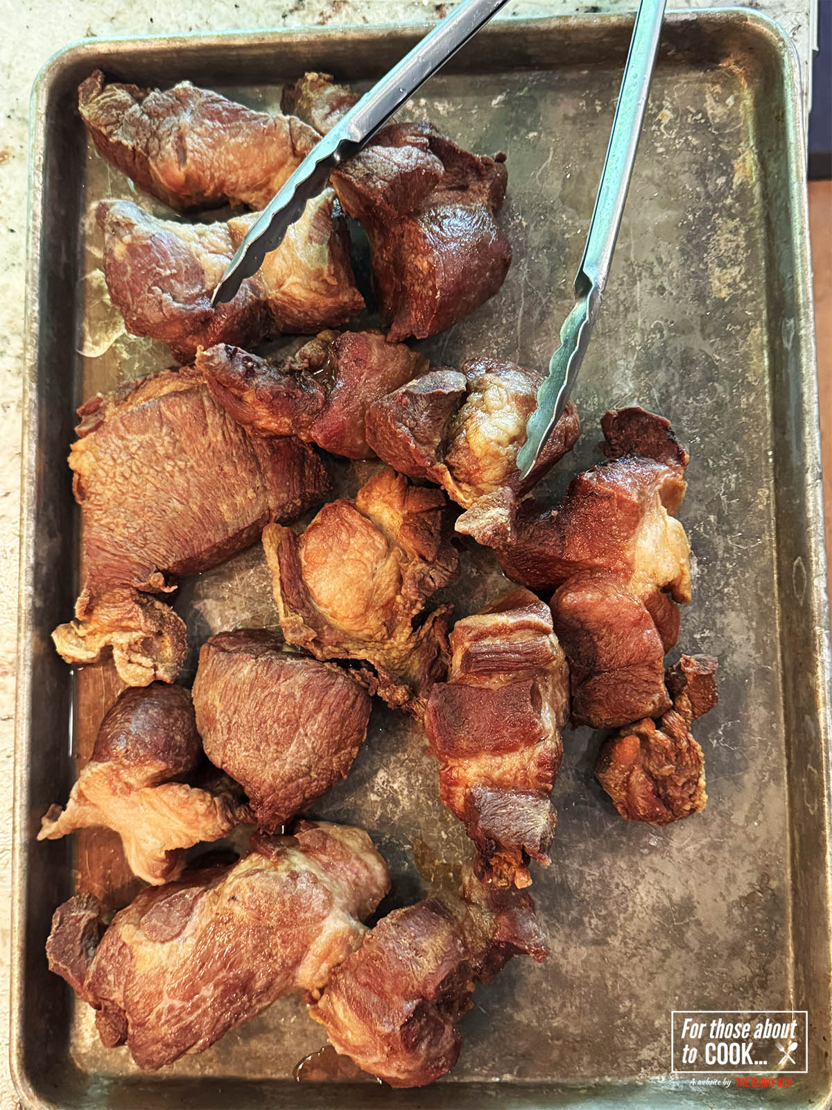 Pork seared and removed from the fat.