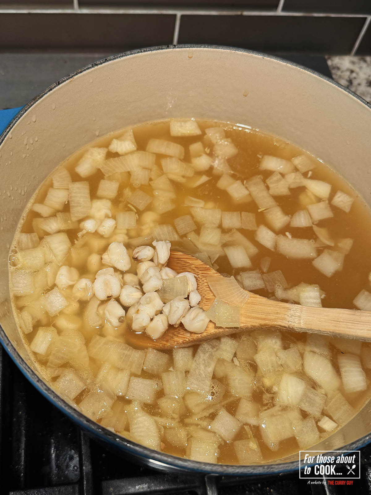 Adding stock and hominy 