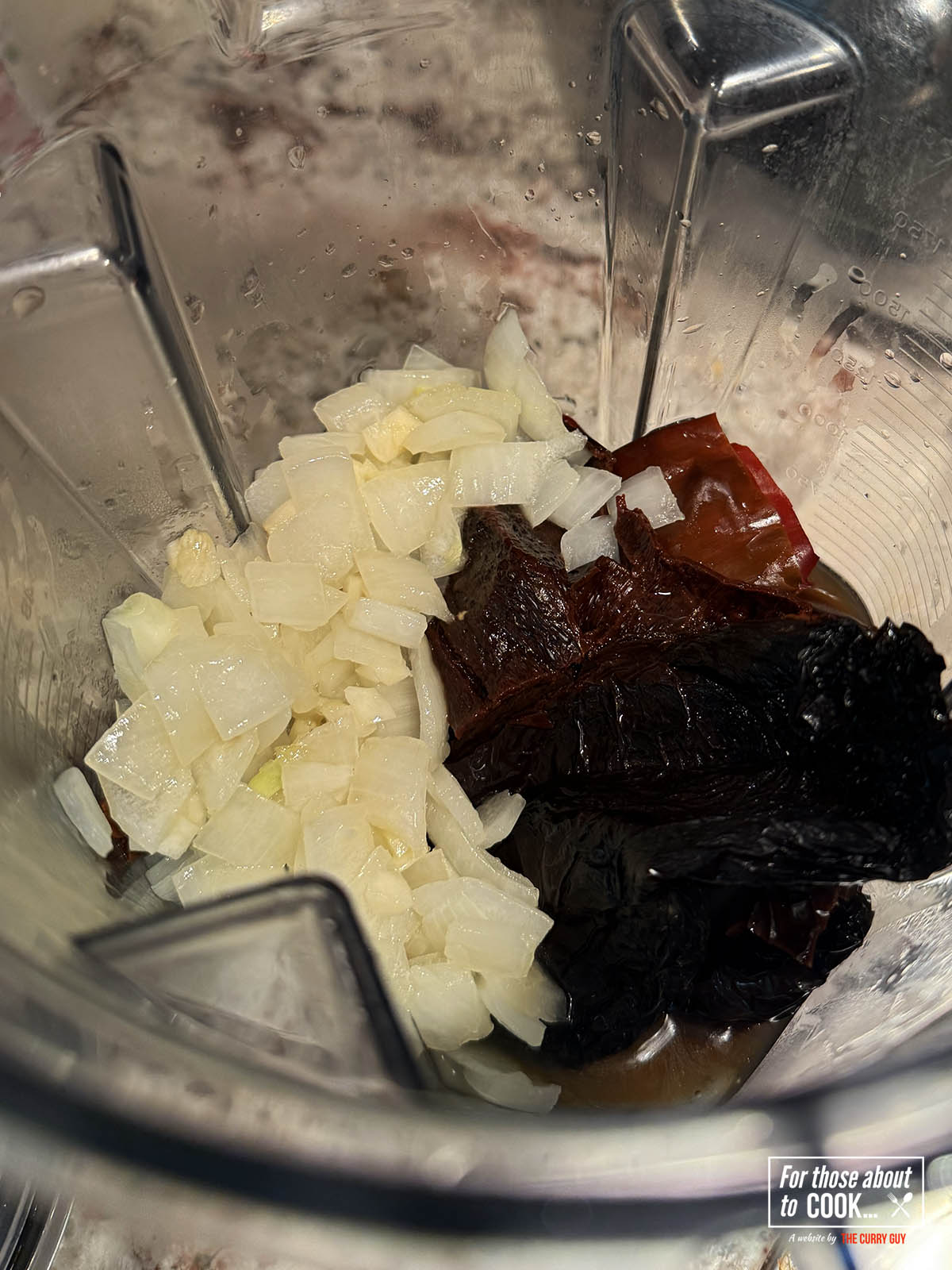 Blending the onions and chilies for the pozole rojo 