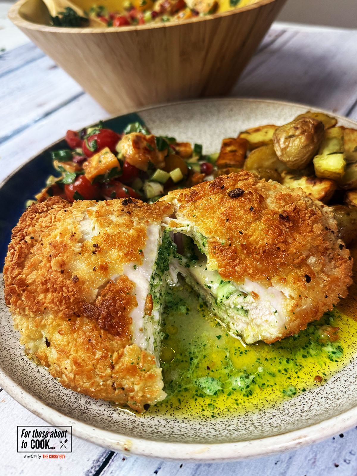 Chicken Kiev recipe plated up with garlic butter oozing out