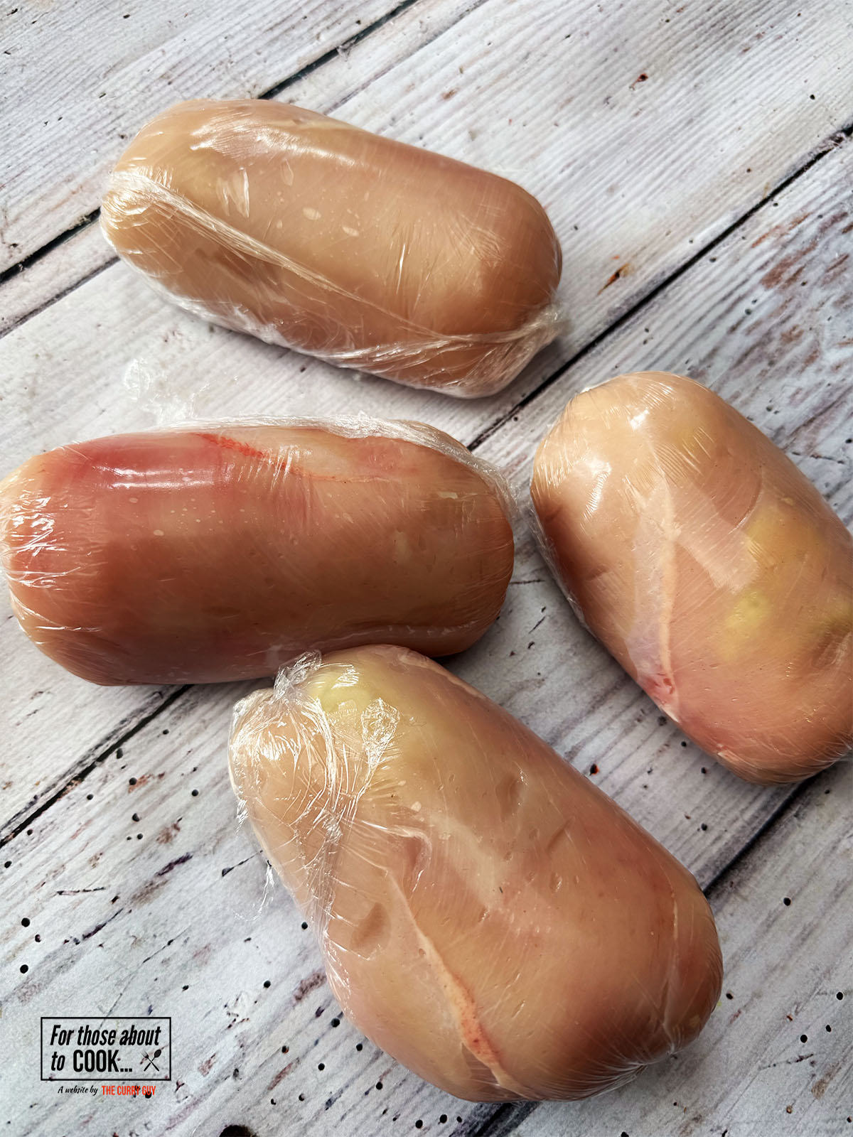 Chicken Kievs wrapped in saranwrap and chilled in the fridge