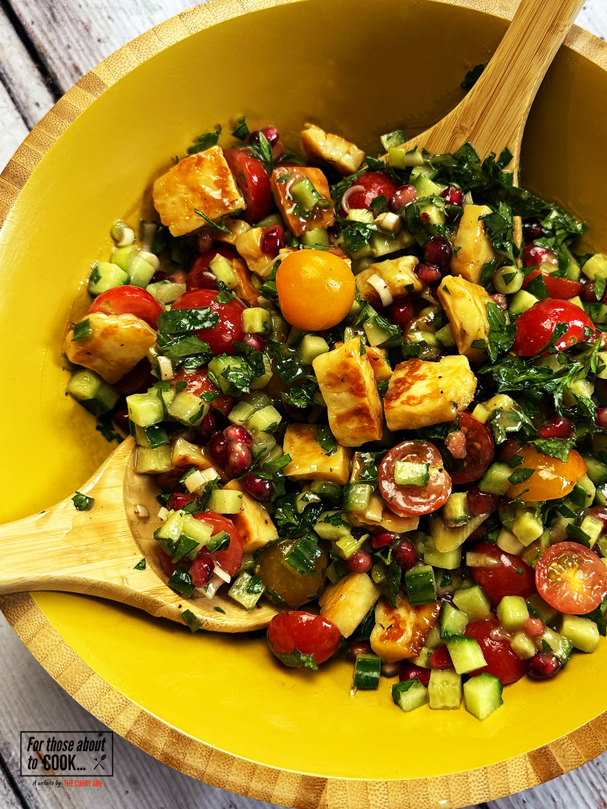 Halloumi Salad served in a large bowl with tahini dressing