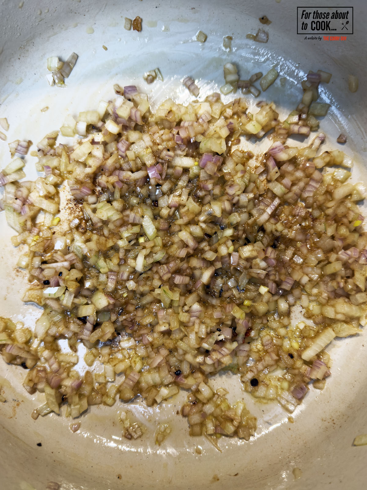 Shallots and garlic sauteing in a pot