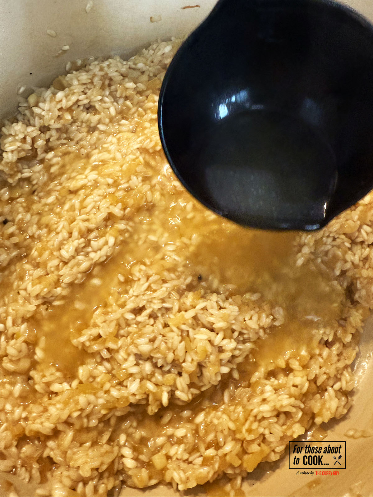 Chicken stock gradually added to the pot