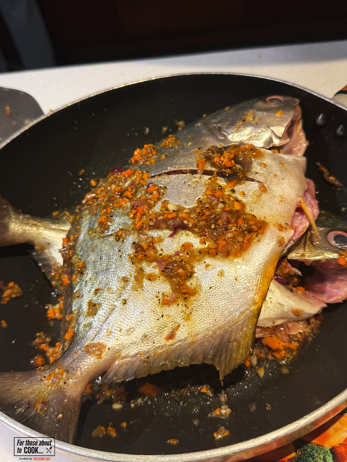 rubbing the marinade on the vietnamese fish