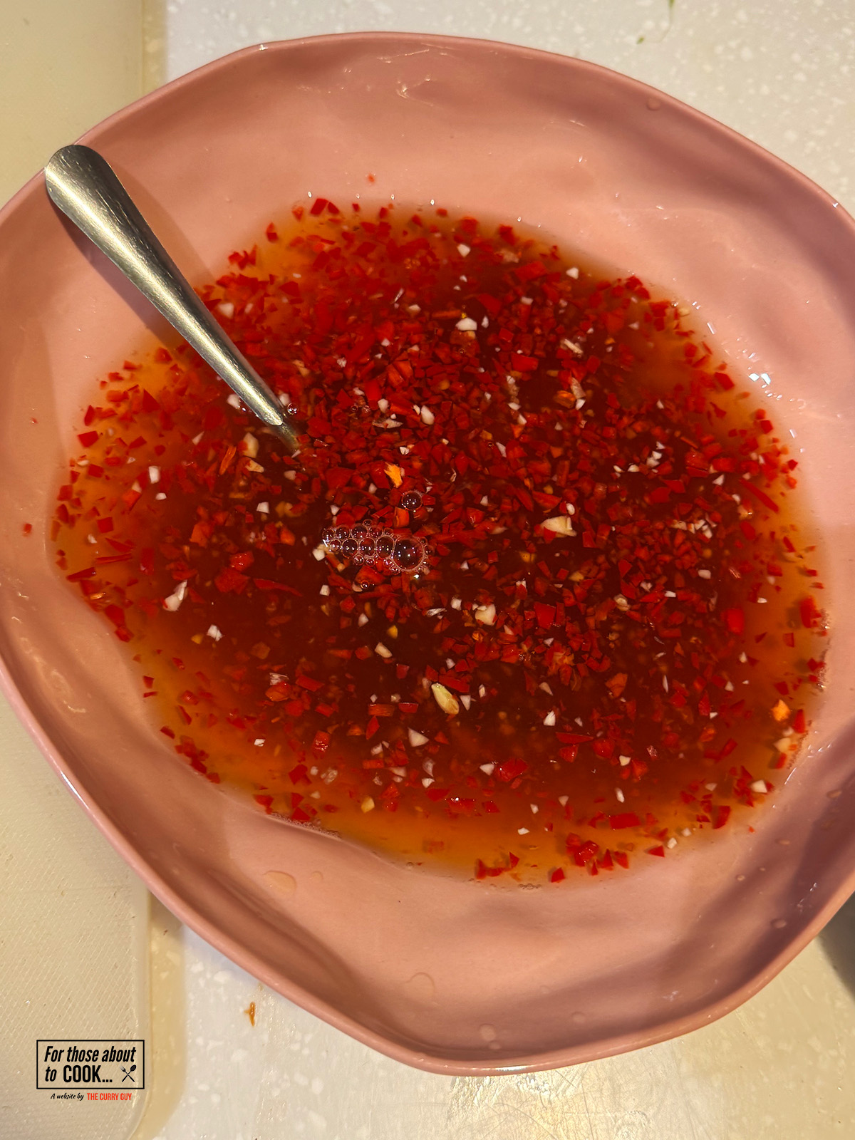 mixing together the dipping sauce ingredients
