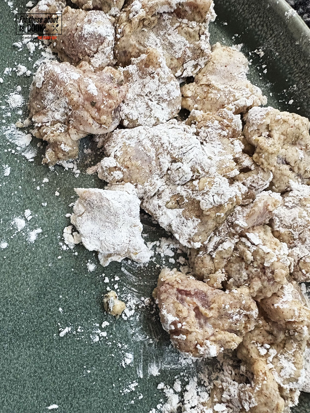coating the chicken in the flour mixture