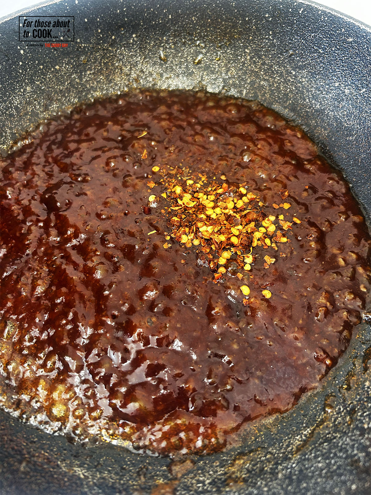 adding the spice to the hot honey sauce